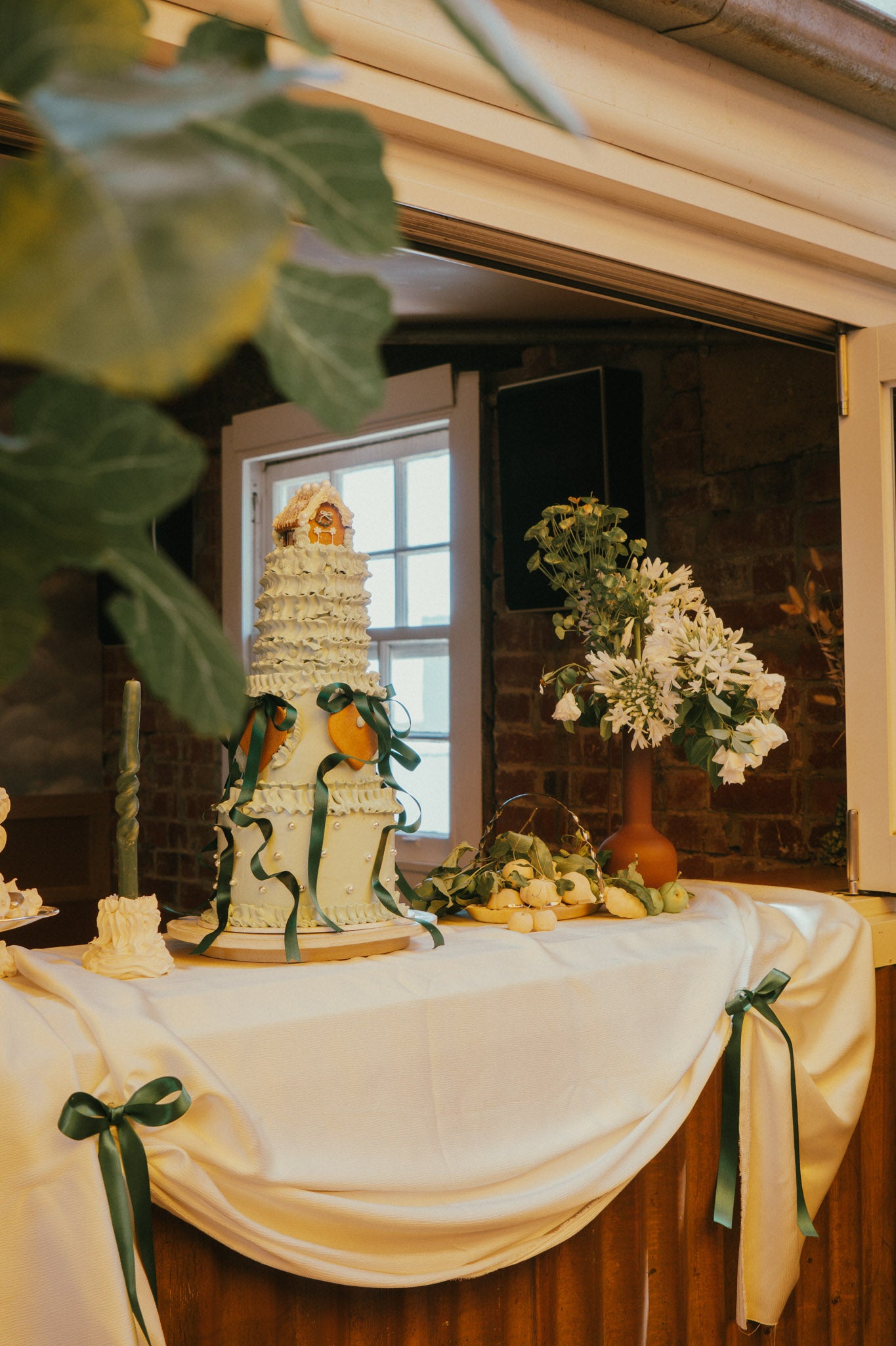 Decorative still life drawing set up with a cake and flowers in a rustic setting at Runner Up Rooftop in Collingwood